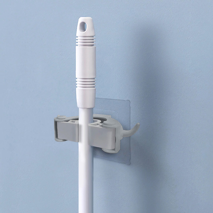Broom holder Hangs with adhesive SmartaSaker
