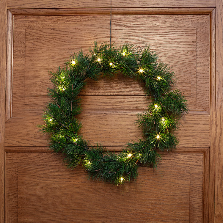 Battery powered door wreath with timer
