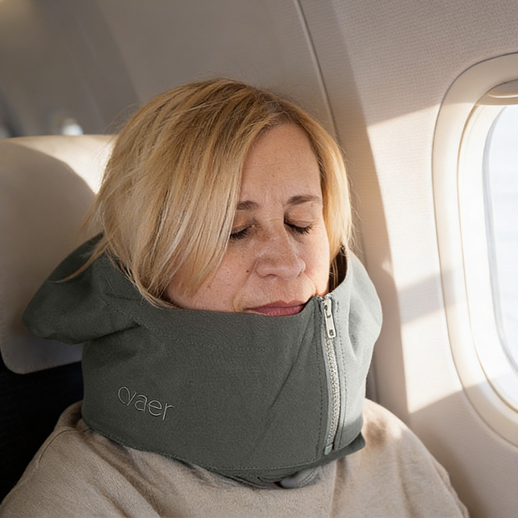 Travel pillow with a hood
