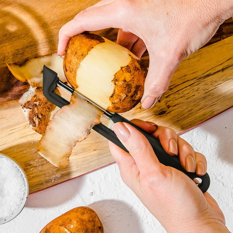 Self-sharpening potato peeler