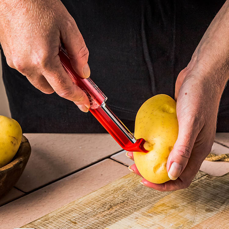 Self-sharpening potato peeler