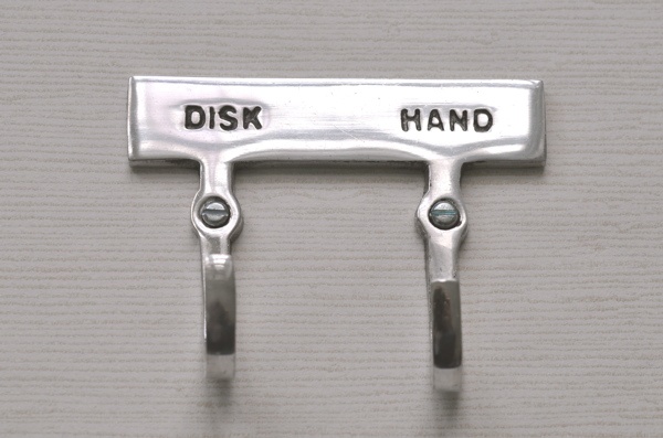 Double hook with sign, DISK & HAND, Exmez, Sand-cast aluminum