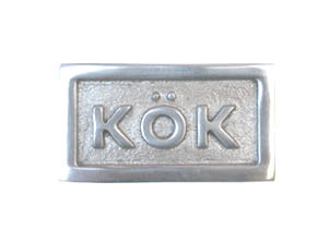 Sign with frame, KÖK, 6,5 x 3,5 cm, Exmez, Sand-cast aluminum
