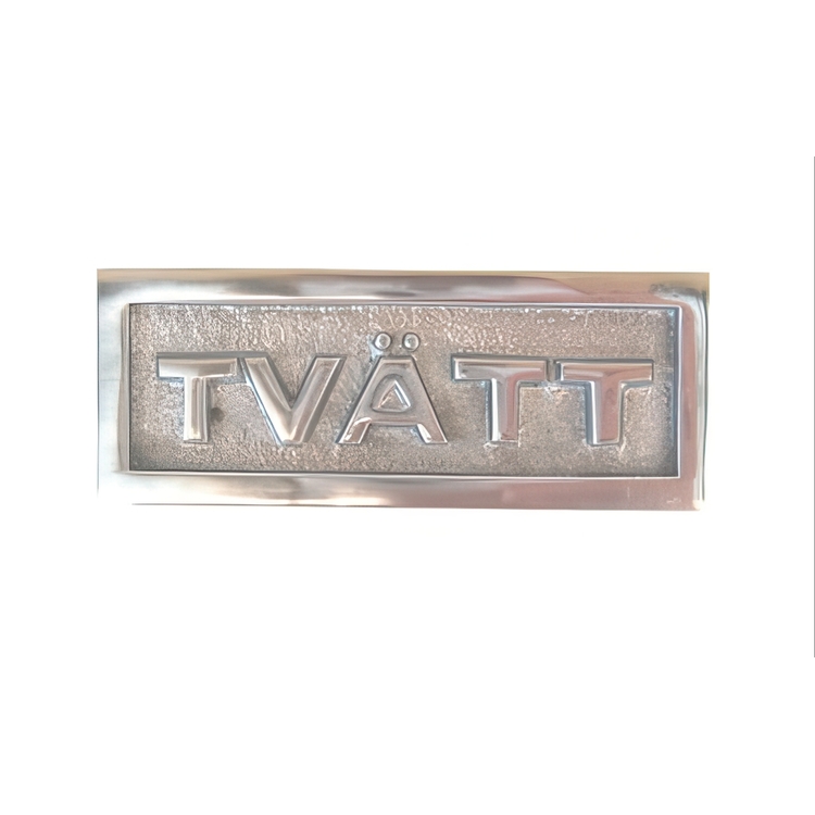 Sign with frame, TVÄTT, 9 x H 3,5 cm, Exmez, Sand-cast aluminum