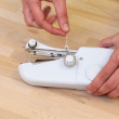 Handheld sewing machine