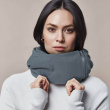 Travel pillow with a hood