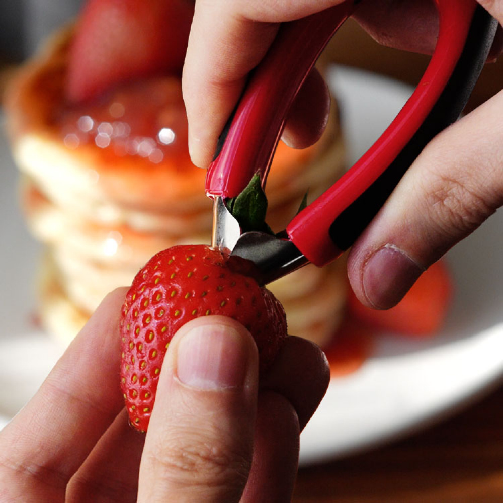 De-stem strawberries with the metal strawberry huller