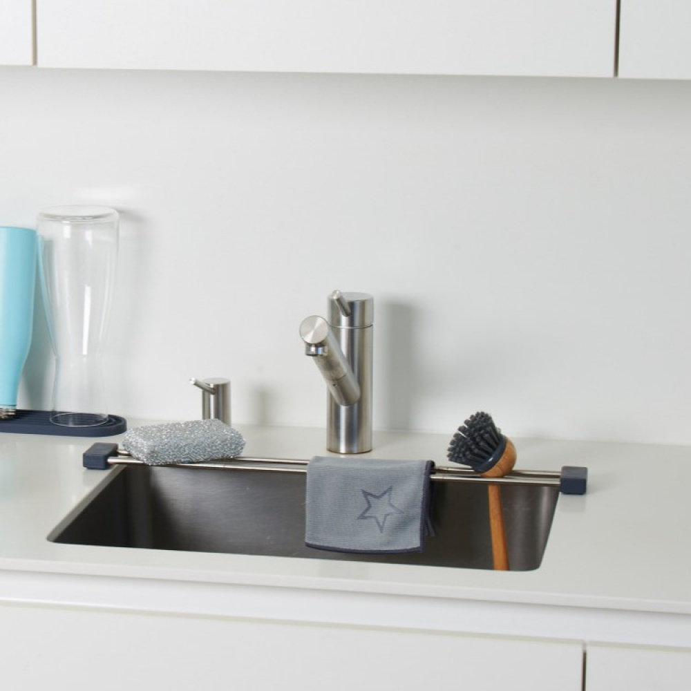 Adjustable divider and drying rack for the sink