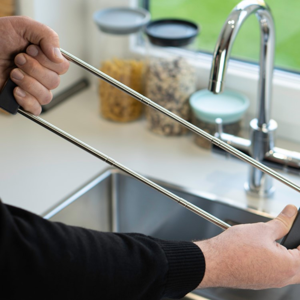 Adjustable divider and drying rack for the sink