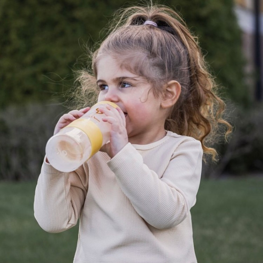 Toddler Drinking Milk Bottle