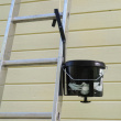 Paint can holder for ladder