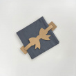 Leather napkin holder with bow