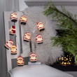 String lights with Santas and music