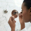 Magnifying travel mirror