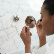 Magnifying travel mirror