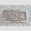 Sign with frame, KÖK, 6,5 x 3,5 cm, Exmez, Sand-cast aluminum Sign with frame, KÖK, 6,5 x 3,5 cm, Exmez, Sand-cast aluminum