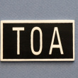Sign, TOA, 7 x 4 cm, Exmez, Aluminum & black Sign, TOA, 7 x 4 cm, Exmez, Aluminum & black
